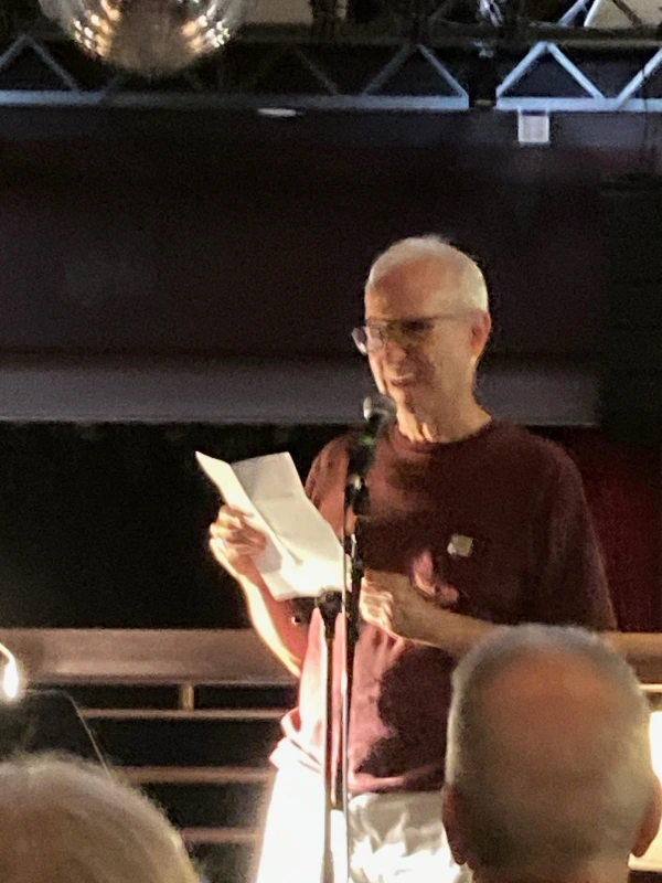 Ralph Earle reading poetry in front of an audience